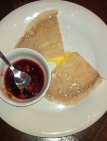 Tangerine Crepes With A Side Of Strawberry Reduction Sauce
